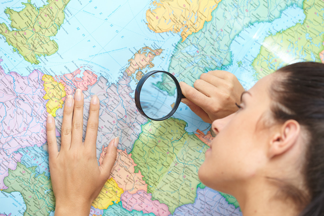 woman looking at world map